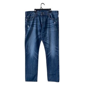 True Religion Dark Blue  Rocco Relaxed Skinny
Beconctracte Jambe
Trés Étroite